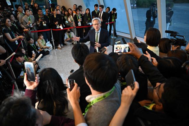 Nvidia founder and CEO Jensen Huang speaks to the media at the Asia-Pacific Economic Cooperation (APEC) CEO Summit in Gyeongju on October 31, 2025. (Photo by Jung Yeon-je / AFP)