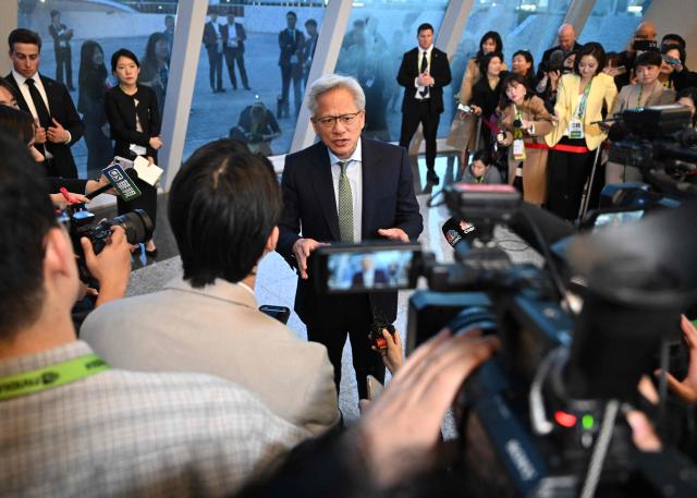 Nvidia founder and CEO Jensen Huang speaks to the media at the Asia-Pacific Economic Cooperation (APEC) CEO Summit in Gyeongju on October 31, 2025. (Photo by Jung Yeon-je / AFP)