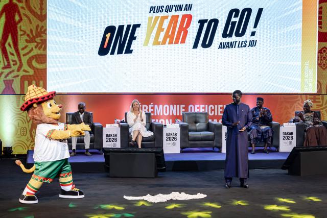 Senegal's President Bassirou Diomaye Faye (3rd R) unveils the official mascot Ayo for the Dakar 2026 Youth Olympics Games at the Grand Theatre in Dakar, on October 31, 2025. Senegal will be the first African country to host the Summer Youth Olympic Games in 2026. (Photo by PATRICK MEINHARDT / AFP)