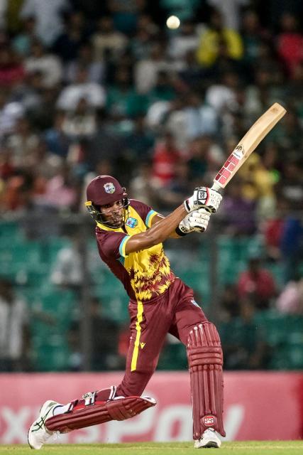 West Indies' captain Roston Chase plays a shot during the third Twenty20 international cricket match between Bangladesh and West Indies at the Bir Sreshtho Flight Lieutenant Matiur Rahman Stadium in Chittagong on October 31, 2025. (Photo by MUNIR UZ ZAMAN / AFP)