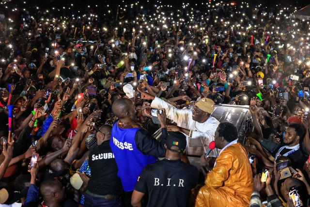 (FILES) Supporters gather around Cameroonian presidential candidate Issa Tchiroma Bakary (C) during a campaign rally in Douala on October 5, 2025. Opposition leader Issa Tchiroma Bakary, who claims victory in the Cameroonian presidential election, asserted on October 31, 2025 that he is under the "protection" of a faction of the army and called for support through general strikes in the country, which has been rocked by unrest since Paul Biya's re-election.
On October 27, 2025 President Paul Biya, 92, who has been in power since 1982 in this Central African nation, was re-elected for an eighth term. His contested re-election has created a climate of tension in Cameroon, as several cities across the country have since been rocked by demonstrations called for by candidate Tchiroma, which have been violently suppressed by the regime. (Photo by Daniel BELOUMOU OLOMO / AFP)