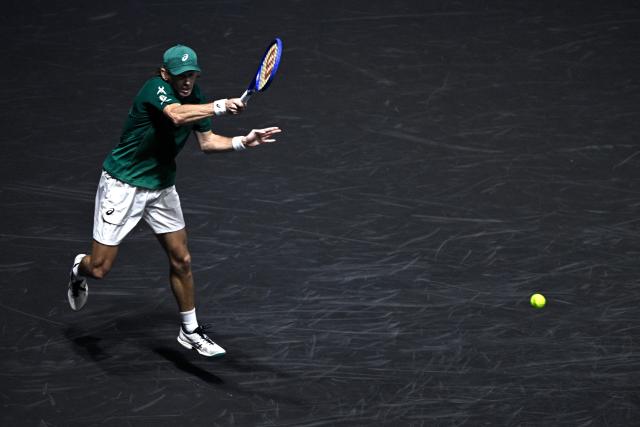 Australia's Alex De Minaur plays a forehand return to Kazakhstan's Alexander Bublik during their men's singles quarter-final match on day five of the Paris ATP Masters 1000 tennis tournament at the Paris La Défense Arena in Nanterre, on the outskirts of Paris, on October 31, 2025. (Photo by JULIEN DE ROSA / AFP)