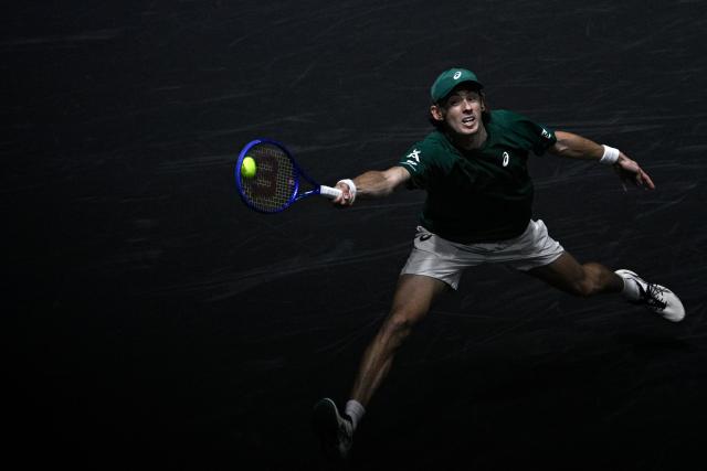 Australia's Alex De Minaur plays a forehand return to Kazakhstan's Alexander Bublik during their men's singles quarter-final match on day five of the Paris ATP Masters 1000 tennis tournament at the Paris La Défense Arena in Nanterre, on the outskirts of Paris, on October 31, 2025. (Photo by JULIEN DE ROSA / AFP)
