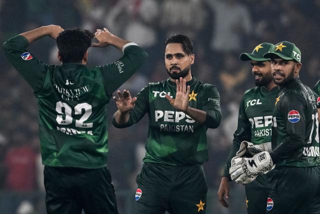 Pakistan's Faheem Ashraf (C) celebrates with teammates after taking the wicket of South Africa's Dewald Brevis during the second Twenty20 international cricket match between Pakistan and South Africa at Gaddafi Stadium in Lahore on October 31, 2025. (Photo by Farooq NAEEM / AFP)