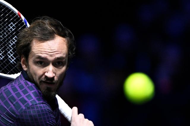 Russia's Daniil Medvedev eyes the ball as he plays against Germany's Alexander Zverev during their men's singles quarter-final match on day five of the Paris ATP Masters 1000 tennis tournament at the Paris La Défense Arena in Nanterre, on the outskirts of Paris, on October 31, 2025. (Photo by JULIEN DE ROSA / AFP)