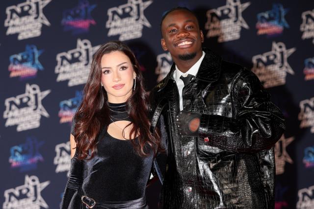 Former Star Academy participant Lenie and Congolese-French singer, songwriter Jungeli pose on the red carpet upon arrival to attend the 27th edition of the NRJ Music Awards ceremony at the Palais des Festivals, in Cannes, southeastern France, on October 31, 2025. (Photo by Valery HACHE / AFP)