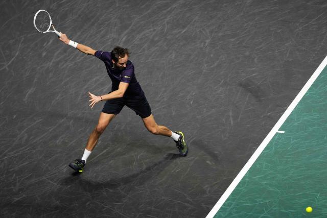 Russia's Daniil Medvedev plays a forehand return to Germany's Alexander Zverev during their men's singles quarter-final match on day five of the Paris ATP Masters 1000 tennis tournament at the Paris La Défense Arena in Nanterre, on the outskirts of Paris, on October 31, 2025. (Photo by Dimitar DILKOFF / AFP)