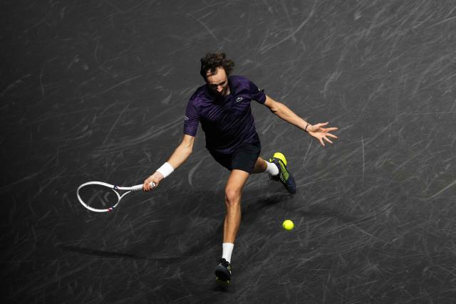 Russia's Daniil Medvedev plays a forehand return to Germany's Alexander Zverev during their men's singles quarter-final match on day five of the Paris ATP Masters 1000 tennis tournament at the Paris La Défense Arena in Nanterre, on the outskirts of Paris, on October 31, 2025. (Photo by Dimitar DILKOFF / AFP)