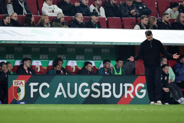 Augsburg's German head coach Sandro Wagner reacts at the end of the German first division Bundesliga football match between FC Augsburg and Borussia Dortmund in Augsburg, southern Germany on October 31, 2025. Dortmund won the match 1-0. (Photo by Alexandra BEIER / AFP) / DFL REGULATIONS PROHIBIT ANY USE OF PHOTOGRAPHS AS IMAGE SEQUENCES AND/OR QUASI-VIDEO