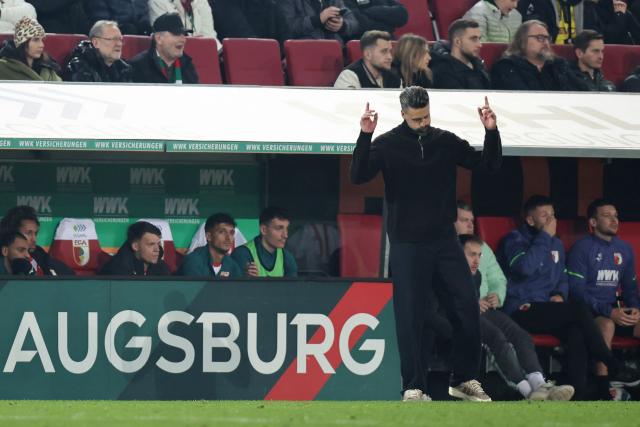 Augsburg's German head coach Sandro Wagner reacts at the end of the German first division Bundesliga football match between FC Augsburg and Borussia Dortmund in Augsburg, southern Germany on October 31, 2025. Dortmund won the match 1-0. (Photo by Alexandra BEIER / AFP) / DFL REGULATIONS PROHIBIT ANY USE OF PHOTOGRAPHS AS IMAGE SEQUENCES AND/OR QUASI-VIDEO