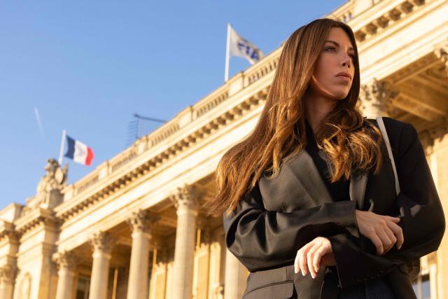 Swiss and French racing driver Laura Villars, poses in front of the FIA headquarters in Paris, on October 31, 2025. Swiss racing driver Laura Villars filed legal action on October 29, 2025 against motorsport's governing body to challenge FIA election rules, which she argues prevent her or any other candidate from running against incumbent president Mohammed Ben Sulayem. (Photo by JOEL SAGET / AFP)