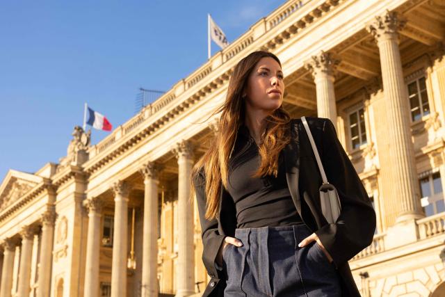 Swiss and French racing driver Laura Villars, poses in front of the FIA headquarters in Paris, on October 31, 2025. Swiss racing driver Laura Villars filed legal action on October 29, 2025 against motorsport's governing body to challenge FIA election rules, which she argues prevent her or any other candidate from running against incumbent president Mohammed Ben Sulayem. (Photo by JOEL SAGET / AFP)