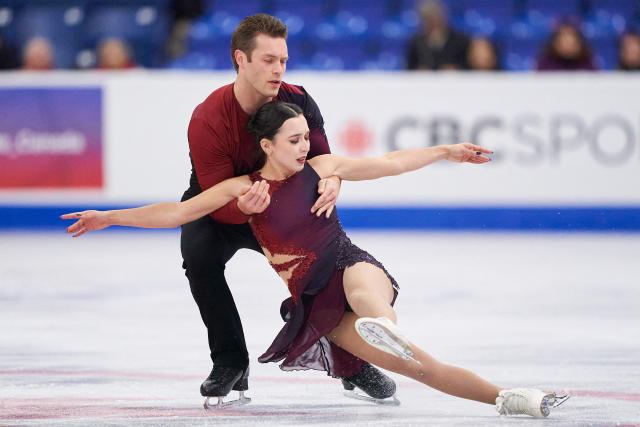 Lia Pereira and Trennt Michaud of Canada skate in the pairs competition during the ISU Grand Prix of Figure Skating 2025 Skate Canada International at the SaskTel Centre in Saskatoon, Saskatchewan, Canada on October 31, 2025. (Photo by Geoff Robins / AFP)