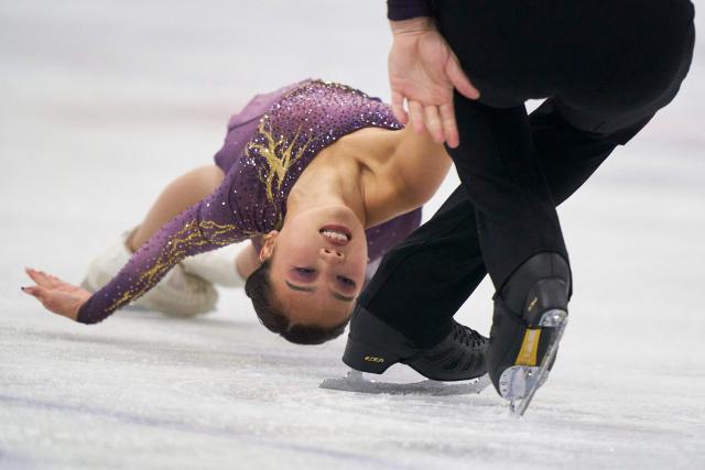 Ellie Kam and Danny O'Shea of the United States skate in the pairs competition during the ISU Grand Prix of Figure Skating 2025 Skate Canada International at the SaskTel Centre in Saskatoon, Saskatchewan, Canada on October 31, 2025. (Photo by Geoff Robins / AFP)