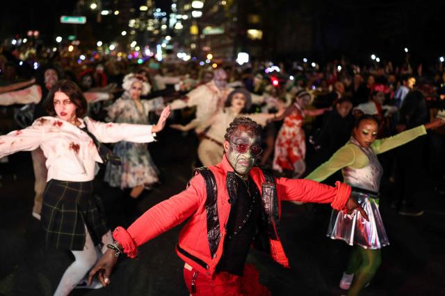 Costumed revellers take part in the Halloween parade in Manhattan, New York City, on October 31, 2025. (Photo by CHARLY TRIBALLEAU / AFP)