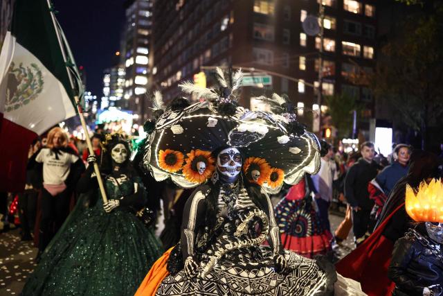 Costumed revellers take part in the Halloween parade in Manhattan, New York City, on October 31, 2025. (Photo by CHARLY TRIBALLEAU / AFP)