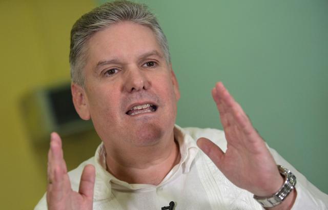 (FILES) Cuban Economy Minister Alejandro Gil talks during an interview with AFP at the Economy Ministry in Havana, on December 17, 2019. Former Cuban Economy Minister Alejandro Gil, dismissed from his position in 2024, was charged with espionage and various economic crimes, including corruption, embezzlement, and tax evasion, Cuba's attorney general's office announced on October 31, 2025. (Photo by Yamil LAGE / AFP)