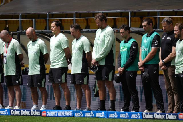 New Zealand players stand for a minute's silence for the passing of Australian teen cricketer Ben Austin who died after being hit by a ball in the nets before a local game in Melbourne, during the 3rd ODI cricket match between New Zealand and England at Sky Stadium in Wellington on November 1, 2025. (Photo by Marty MELVILLE / AFP)