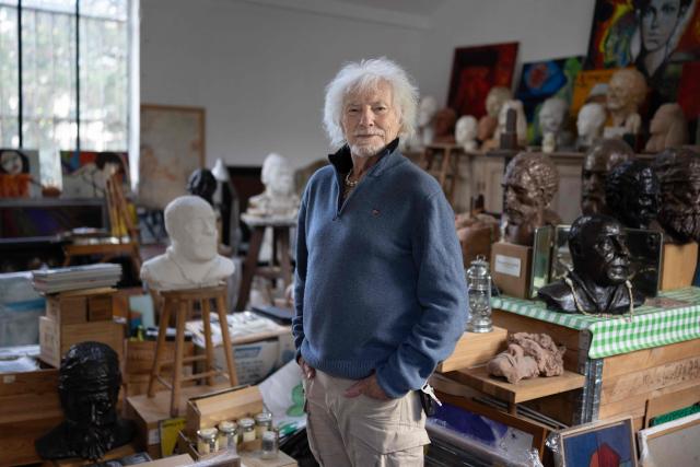 (FILES) French singer, songwriter, and composer Hugues Aufray poses in the former studio of the French-Catalan artist Aristide Maillol, among his sculptures, during a photo session in Marly-le-Roi near Paris, on October 14, 2025. "Santiano", "Céline", "Stewball"...: crowned with timeless successes, including adaptations of his friend Bob Dylan's songs, Hugues Aufray, a guiding figure in Francophone music, continues his journey with undiminished energy and embarks on a new tour at the age of 96. (Photo by JOEL SAGET / AFP)
