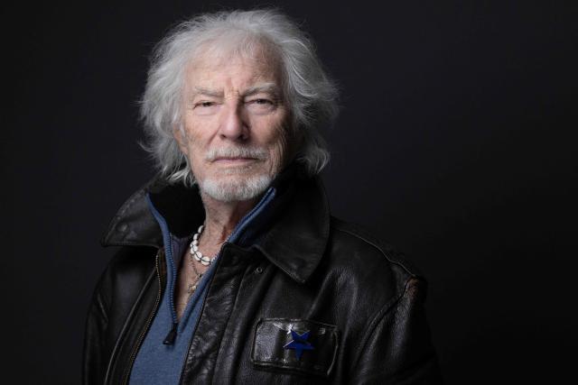 (FILES) French singer, songwriter, and composer Hugues Aufray poses for a photo session at his home, in Marly-le-Roi near Paris, on October 14, 2025. "Santiano", "Céline", "Stewball"...: crowned with timeless successes, including adaptations of his friend Bob Dylan's songs, Hugues Aufray, a guiding figure in Francophone music, continues his journey with undiminished energy and embarks on a new tour at the age of 96. (Photo by JOEL SAGET / AFP)