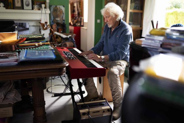 (FILES) French singer, songwriter, and composer Hugues Aufray plays plays piano in his studio at the former house of the French-Catalan artist Aristide Maillol, in Marly-le-Roi near Paris, on October 14, 2025. "Santiano", "Céline", "Stewball"...: crowned with timeless successes, including adaptations of his friend Bob Dylan's songs, Hugues Aufray, a guiding figure in Francophone music, continues his journey with undiminished energy and embarks on a new tour at the age of 96. (Photo by JOEL SAGET / AFP)