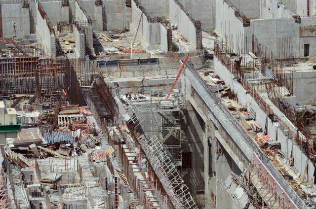 (FILES) Picture of one of the construction sites of the new set of locks of the Panama Canal, in Colon, 100 km from Panama City, taken on February 20, 2014. The Panamanian government announced on October 31, 2025, that it had won a lawsuit brought by Spanish company Sacyr, which was claiming $2.3 billion for the expansion of the Panama Canal. (Photo by Ed Grimaldo / AFP)
