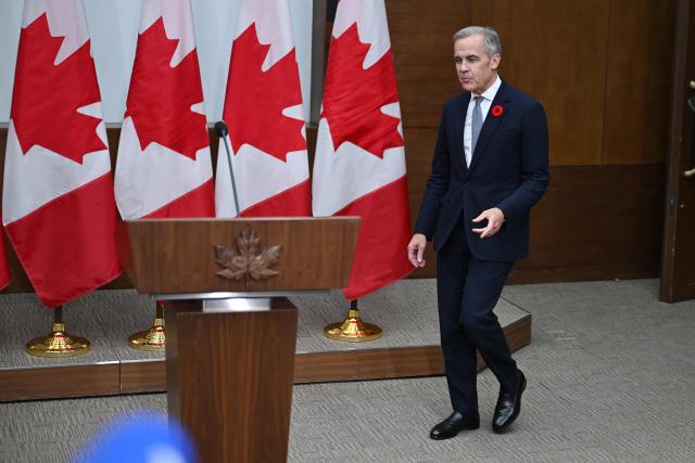 Canada's Prime Minister Mark Carney arrives at a press conference after the 2025 Asia-Pacific Economic Cooperation (APEC) Economic Leaders' Meeting in Gyeongju on November 1, 2025. (Photo by JUNG Yeon-je / AFP)