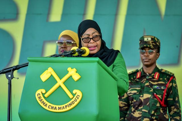 (FILES) Tanzania’s ruling party Chama Cha Mapinduzi (CCM) presidential candidate and incumbent President Samia Suluhu Hassan delivers her remarks during the party's closing campaign rally in Mwanza on October 28, 2025. Tanzanian President Samia Suluhu Hassan won a landslide election victory with 97.66 percent of the vote, the electoral commission announced on November 1, 2025, after polls that lacked major opposition candidates and descended into violent protests. (Photo by Michael JAMSON / AFP)