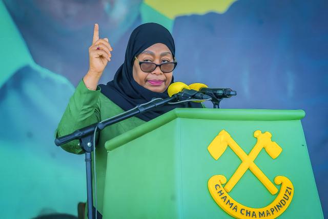 (FILES) Tanzania’s ruling party Chama Cha Mapinduzi (CCM) presidential candidate and incumbent President Samia Suluhu Hassan delivers her remarks during the party's closing campaign rally in Mwanza on October 28, 2025. Tanzanian President Samia Suluhu Hassan won a landslide election victory with 97.66 percent of the vote, the electoral commission announced on November 1, 2025, after polls that lacked major opposition candidates and descended into violent protests. (Photo by Michael JAMSON / AFP)
