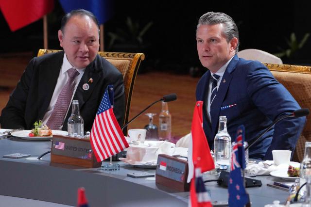 US Secretary of Defense Pete Hegseth (R) confers with Philippines' Defence Secretary Gilberto Teodoro during a ministerial lunch at the Association of Southeast Asian Nations (ASEAN) Defence Ministers' Meeting in Kuala Lumpur on November 1, 2025. (Photo by Dita ALANGKARA / POOL / AFP)