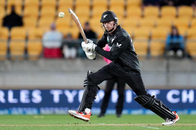 New Zealand's captain Mitchell Santner plays a shot during the third one-day international (ODI) cricket match between New Zealand and England at Sky Stadium in Wellington on November 1, 2025. (Photo by Marty MELVILLE / AFP)