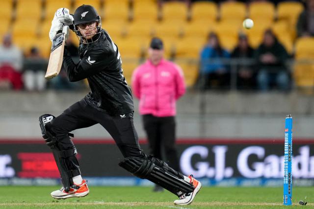 New Zealand's captain Mitchell Santner plays a shot during the third one-day international (ODI) cricket match between New Zealand and England at Sky Stadium in Wellington on November 1, 2025. (Photo by Marty MELVILLE / AFP)