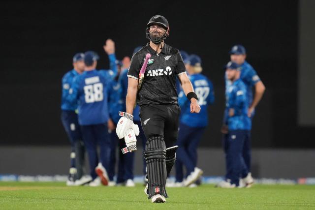 New Zealand's Daryl Mitchell walks from the field after being caught during the third one-day international (ODI) cricket match between New Zealand and England at Sky Stadium in Wellington on November 1, 2025. (Photo by Marty MELVILLE / AFP)