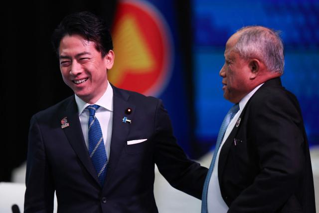 Japan's Defence Minister Shinjiro Koizumi (L) talks with Brunei's Defense Minister Halbi bin Haji Mohd Yussof (R) during the ASEAN-Japan Defence Ministers' Informal Meeting at the Association of Southeast Asian Nations (ASEAN) Defence Ministers' Meeting in Kuala Lumpur on November 1, 2025. (Photo by FAZRY ISMAIL / POOL / AFP)