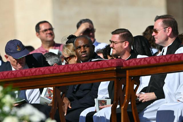 Britain's Justice Secretary and deputy Prime Minister David Lammy (C) arrives to attend the Solemnity of All Saints with the Rite of Proclamation of Saint John Henry Newman as a "Doctor of the Church" on the occasion of the Jubilee of the World Education on All Saints' Day at St. Peter's square, in The Vatican on November 1, 2025. (Photo by Andreas SOLARO / AFP)