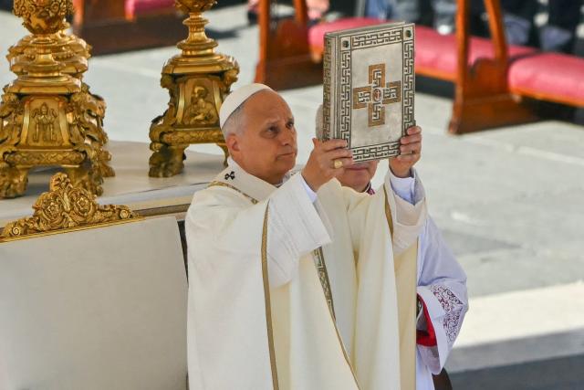 Pope Leo XIV gestures as he leads the mass during the Solemnity of All Saints with the Rite of Proclamation of Saint John Henry Newman as a "Doctor of the Church" on the occasion of the Jubilee of the World Education on All Saints' Day at St. Peter's square, in The Vatican on November 1, 2025. (Photo by Andreas SOLARO / AFP)