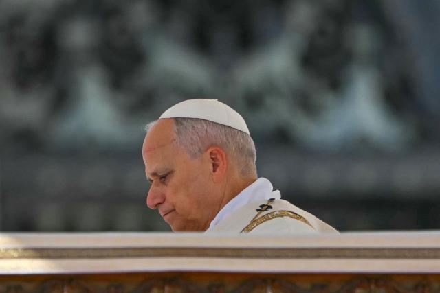 Pope Leo XIV arrives for the Solemnity of All Saints with the Rite of Proclamation of Saint John Henry Newman as a "Doctor of the Church" on the occasion of the Jubilee of the World Education on All Saints' Day at St. Peter's square, in The Vatican on November 1, 2025. (Photo by Andreas SOLARO / AFP)
