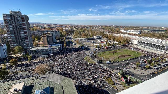 Attendees take part in a gathering marking the first anniversary of the Novi Sad railway station tragedy, in Novi Sad, on November 1, 2025. Tens of thousands gather in Serbia's second largest city Novi Sad to commemorate victims of a railway station collapse a year ago that triggered mass protests. On November 1, 2024, the collapse of the canopy at the newly-renovated railway station in Novi Sad killed 16 people. Regular student-led protests have gripped the Balkan nation since the tragedy, which became a symbol of entrenched corruption. (Photo by Rusmir SMAJILHODZIC / AFP)