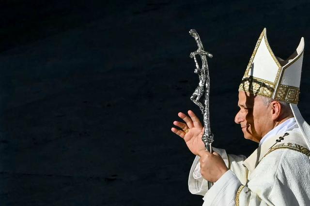 Pope Leo XIV attends the Solemnity of All Saints with the Rite of Proclamation of Saint John Henry Newman as a "Doctor of the Church" on the occasion of the Jubilee of the World Education on All Saints' Day at St. Peter's square, in The Vatican on November 1, 2025. (Photo by Andreas SOLARO / AFP)