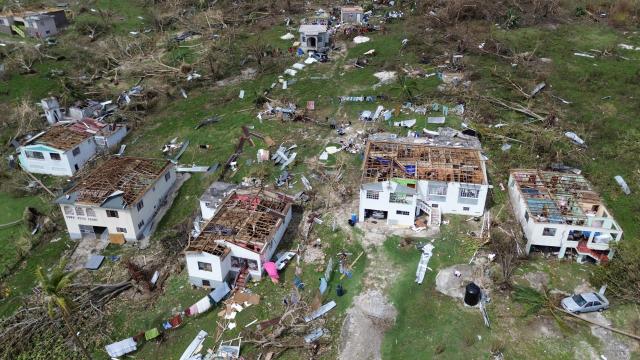 An aerial view shows damaged buildings in the aftermath of Hurricane Melissa in Middle Quarters, St Elizabeth, Jamaica, on October 31, 2025. At least 19 people in Jamaica have died as a result of Hurricane Melissa which devastated the island nation when it roared ashore this week, a government minister told news outlets late October 31. (Photo by Ricardo Makyn / AFP)