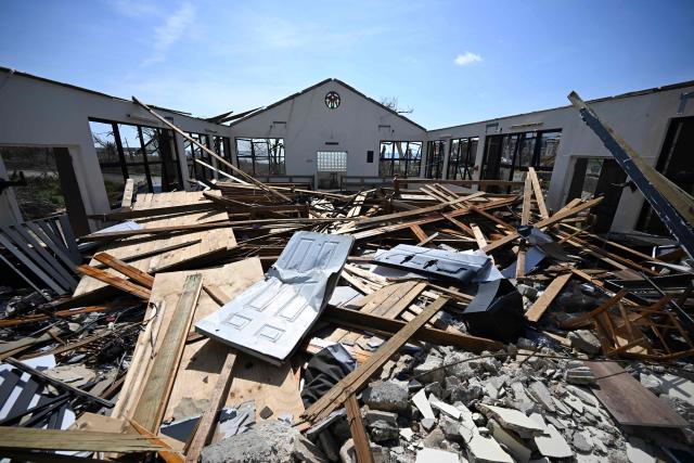 The destroyed Whitehouse Seventh-day Adventist Church, which was used as a shelter during the passage of Hurricane Melissa, is seen in the aftermath of the hurricane in White House, Westmoreland, Jamaica, on October 31, 2025. At least 19 people in Jamaica have died as a result of Hurricane Melissa which devastated the island nation when it roared ashore this week, a government minister told news outlets late October 31. (Photo by Ricardo Makyn / AFP)