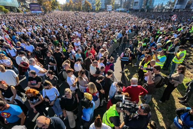 Attendees observe 16 minutes of silence during a gathering marking the first anniversary of the Novi Sad railway station tragedy, in Novi Sad, on November 1, 2025. Tens of thousands gather in Serbia's second largest city Novi Sad to commemorate victims of a railway station collapse a year ago that triggered mass protests. On November 1, 2024, the collapse of the canopy at the newly-renovated railway station in Novi Sad killed 16 people. Regular student-led protests have gripped the Balkan nation since the tragedy, which became a symbol of entrenched corruption. (Photo by Andrej ISAKOVIC / AFP)