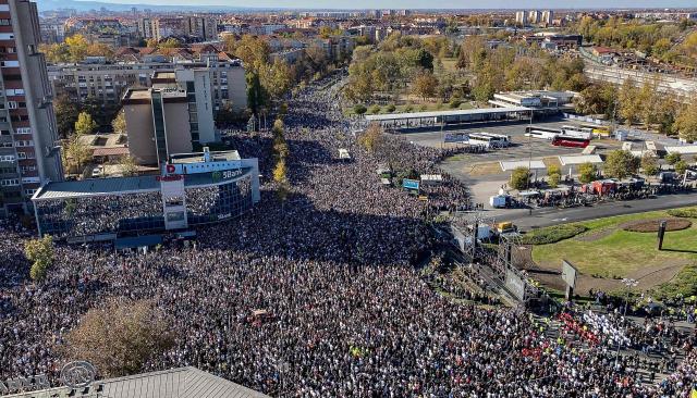 A general view shows attendees taking part in a gathering marking the first anniversary of the Novi Sad railway station tragedy, in Novi Sad, on November 1, 2025. Tens of thousands gather in Serbia's second largest city Novi Sad to commemorate victims of a railway station collapse a year ago that triggered mass protests. On November 1, 2024, the collapse of the canopy at the newly-renovated railway station in Novi Sad killed 16 people. Regular student-led protests have gripped the Balkan nation since the tragedy, which became a symbol of entrenched corruption. (Photo by Rusmir SMAJILHODZIC / AFP)