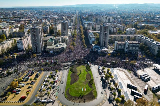 An aerial view shows a gathering marking the first anniversary of the Novi Sad railway station tragedy, in Novi Sad, on November 1, 2025. Tens of thousands gather in Serbia's second largest city Novi Sad to commemorate victims of a railway station collapse a year ago that triggered mass protests. On November 1, 2024, the collapse of the canopy at the newly-renovated railway station in Novi Sad killed 16 people. Regular student-led protests have gripped the Balkan nation since the tragedy, which became a symbol of entrenched corruption. (Photo by Uros Arsic / AFP)