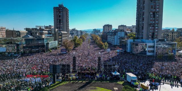An aerial view shows a gathering marking the first anniversary of the Novi Sad railway station tragedy, in Novi Sad, on November 1, 2025. Tens of thousands gather in Serbia's second largest city Novi Sad to commemorate victims of a railway station collapse a year ago that triggered mass protests. On November 1, 2024, the collapse of the canopy at the newly-renovated railway station in Novi Sad killed 16 people. Regular student-led protests have gripped the Balkan nation since the tragedy, which became a symbol of entrenched corruption. (Photo by Uros Arsic / AFP)