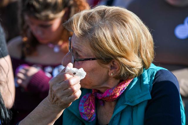 A mourner reacts during  16 minutes of silence during a gathering marking the first anniversary of the Novi Sad railway station tragedy, in Novi Sad, on November 1, 2025. Tens of thousands gather in Serbia's second largest city Novi Sad to commemorate victims of a railway station collapse a year ago that triggered mass protests. On November 1, 2024, the collapse of the canopy at the newly-renovated railway station in Novi Sad killed 16 people. Regular student-led protests have gripped the Balkan nation since the tragedy, which became a symbol of entrenched corruption. (Photo by Nenad MIHAJLOVIC / AFP)