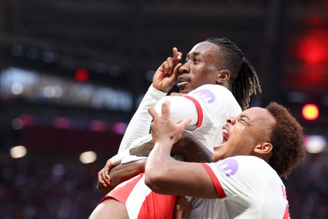 Leipzig's Ivorian forward #49 Yan Diomande (L) and Leipzig's German midfielder #20 Assan Ouedraogo celebrate the team's first goal after Stuttgart's German defender #24 Jeff Chabot scored an own goal during the German first division Bundesliga football match between RB Leipzig and VfB Stuttgart in Leipzig, eastern Germany on November 1, 2025. (Photo by Ronny HARTMANN / AFP) / DFL REGULATIONS PROHIBIT ANY USE OF PHOTOGRAPHS AS IMAGE SEQUENCES AND/OR QUASI-VIDEO