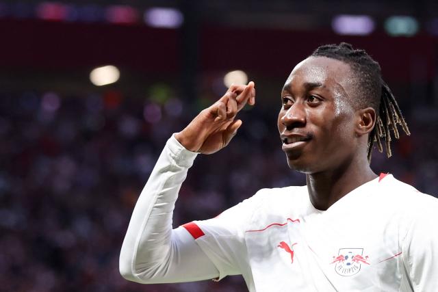 Leipzig's Ivorian forward #49 Yan Diomande celebrates the team's first goal after Stuttgart's German defender #24 Jeff Chabot scored an own goal during the German first division Bundesliga football match between RB Leipzig and VfB Stuttgart in Leipzig, eastern Germany on November 1, 2025. (Photo by Ronny HARTMANN / AFP) / DFL REGULATIONS PROHIBIT ANY USE OF PHOTOGRAPHS AS IMAGE SEQUENCES AND/OR QUASI-VIDEO