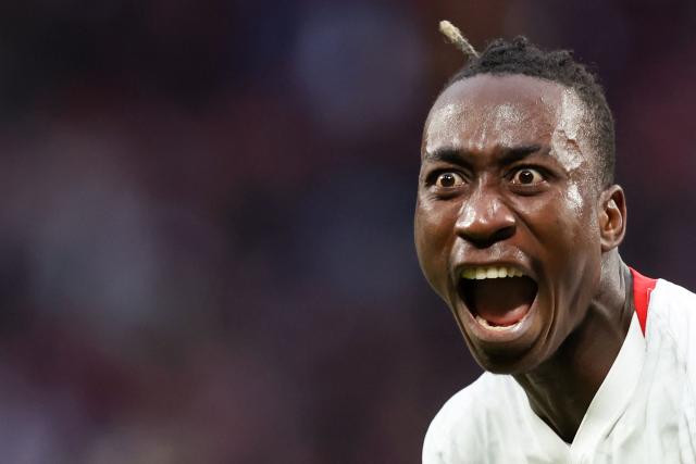 Leipzig's Ivorian forward #49 Yan Diomande celebrates the team's first goal after Stuttgart's German defender #24 Jeff Chabot scored an own goal during the German first division Bundesliga football match between RB Leipzig and VfB Stuttgart in Leipzig, eastern Germany on November 1, 2025. (Photo by Ronny HARTMANN / AFP) / DFL REGULATIONS PROHIBIT ANY USE OF PHOTOGRAPHS AS IMAGE SEQUENCES AND/OR QUASI-VIDEO