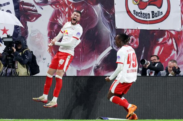 TOPSHOT - Leipzig's Brazilian forward #40 Romulo Cardoso celebrates scoring his team's third goal with Leipzig's Ivorian forward #49 Yan Diomande (R) during the German first division Bundesliga football match between RB Leipzig and VfB Stuttgart in Leipzig, eastern Germany on November 1, 2025. (Photo by Ronny HARTMANN / AFP) / DFL REGULATIONS PROHIBIT ANY USE OF PHOTOGRAPHS AS IMAGE SEQUENCES AND/OR QUASI-VIDEO